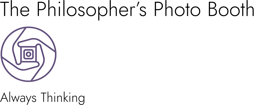 A classic black and white photo of a man deep in thought, representing a philosopher.